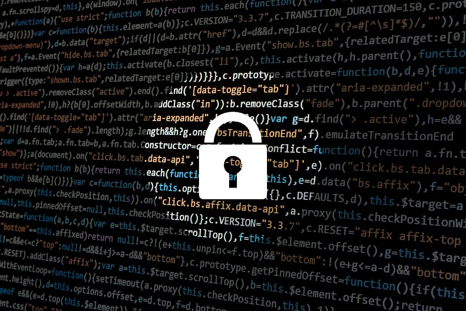 A padlock against a background of strings of coding.