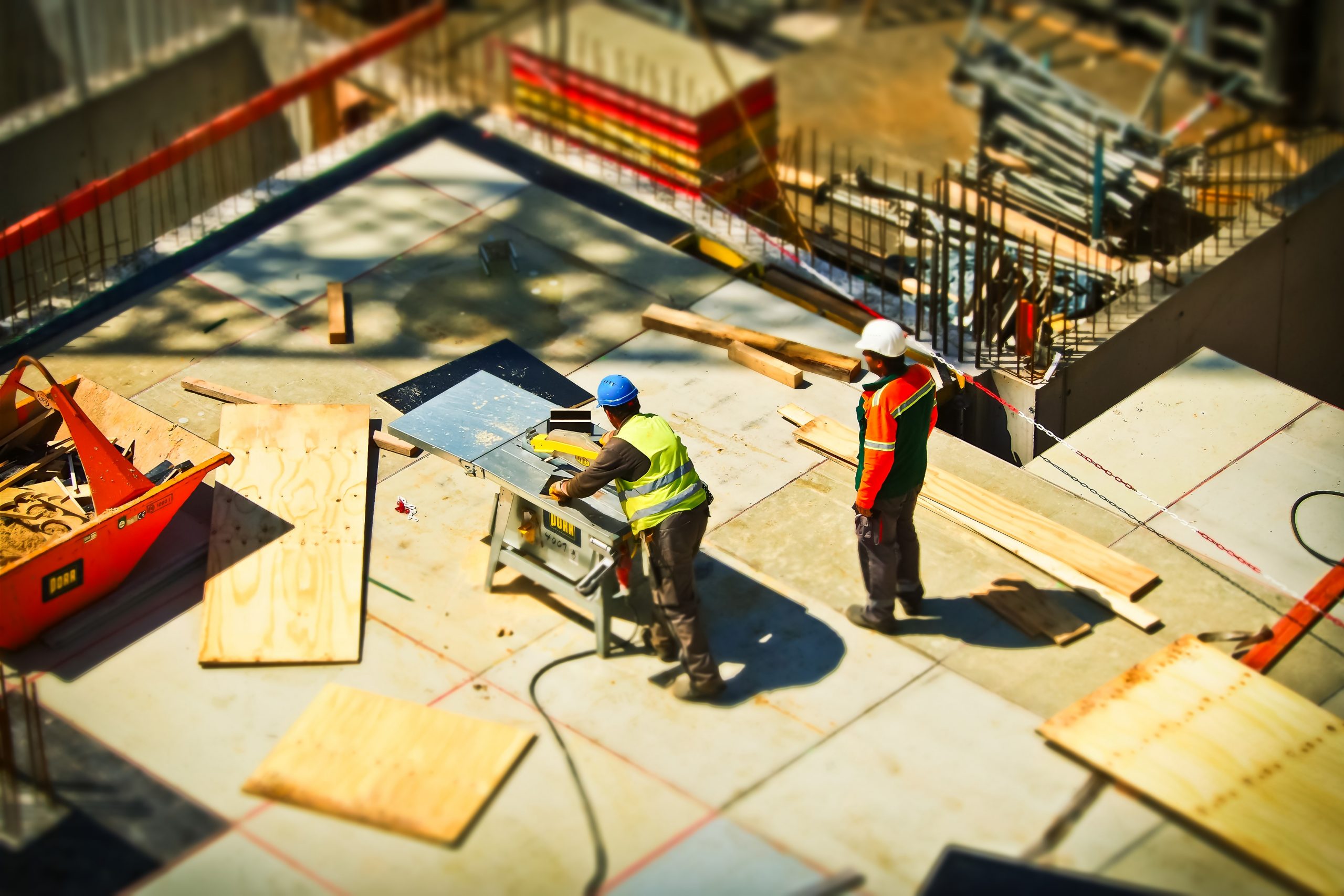 Two workers on a construction site.