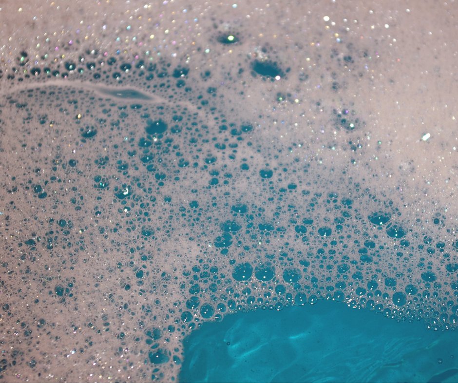 Blue liquid with foamy bubbles on top.