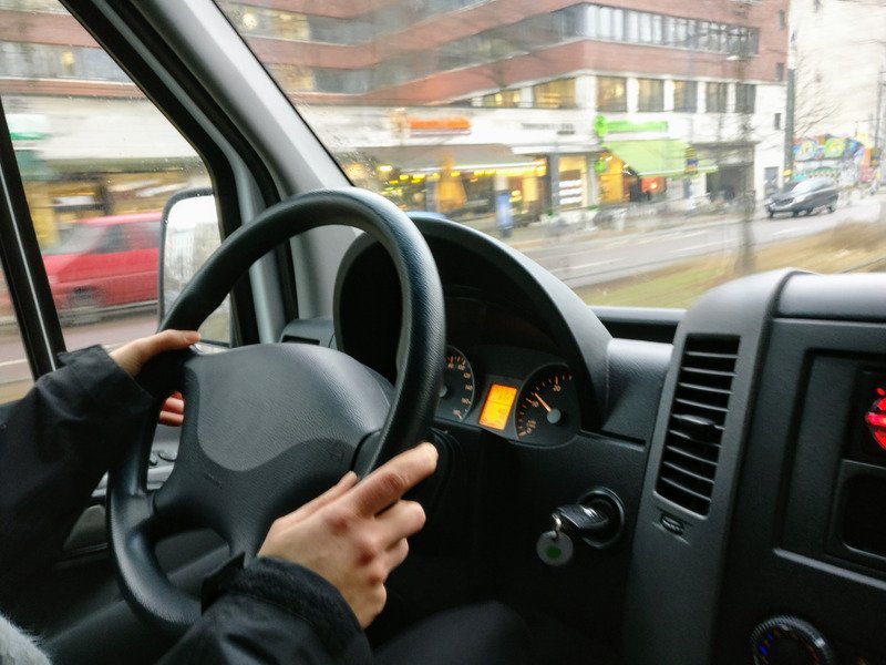 A person driving a car.