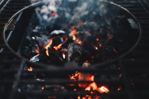 Charcoals burning on a barbeque.