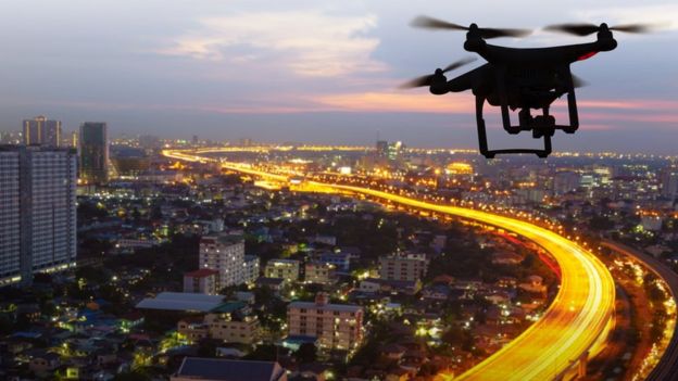 A drone flying above a city.
