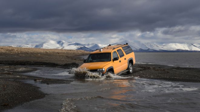 A 4x4 driving through peatlands.