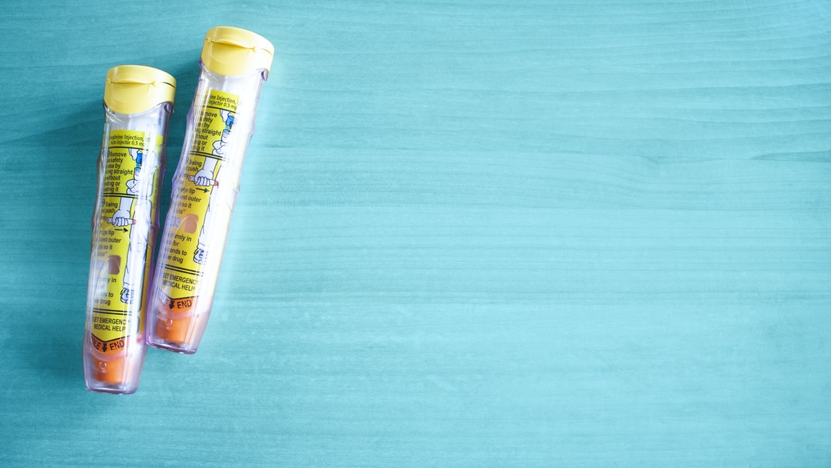 Epinepherine Auto-Injectors with Teal Background