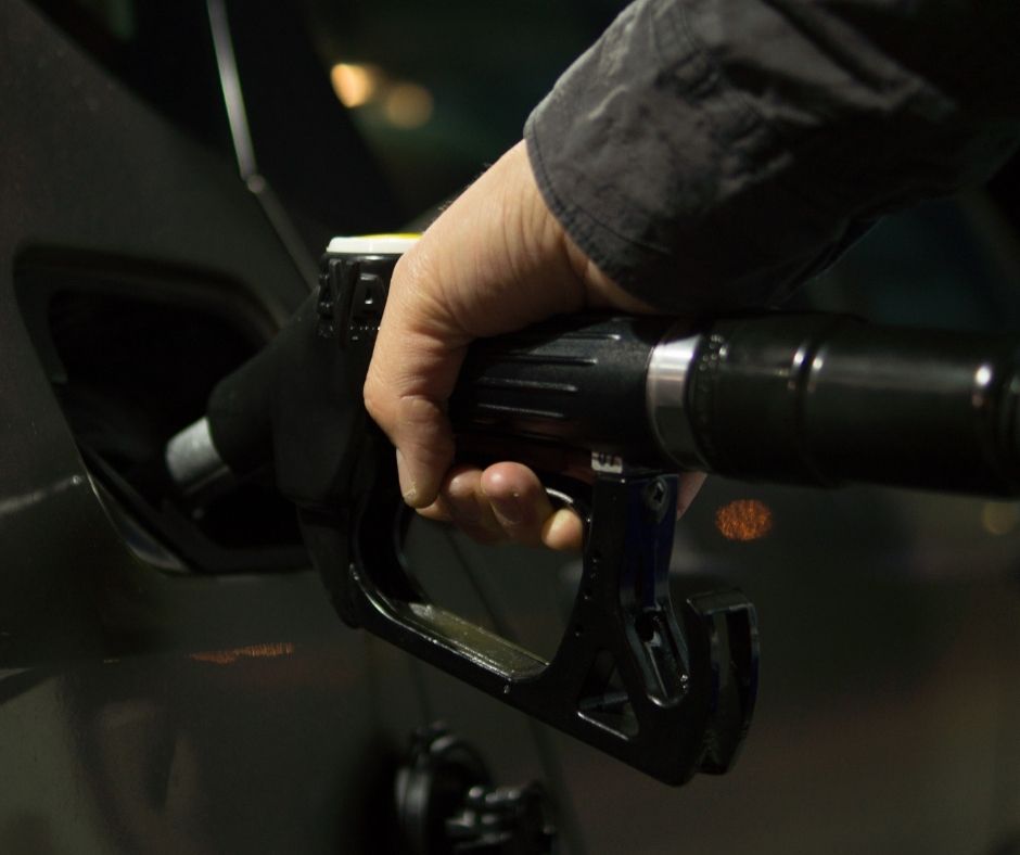 Close up of someone using a petrol pump