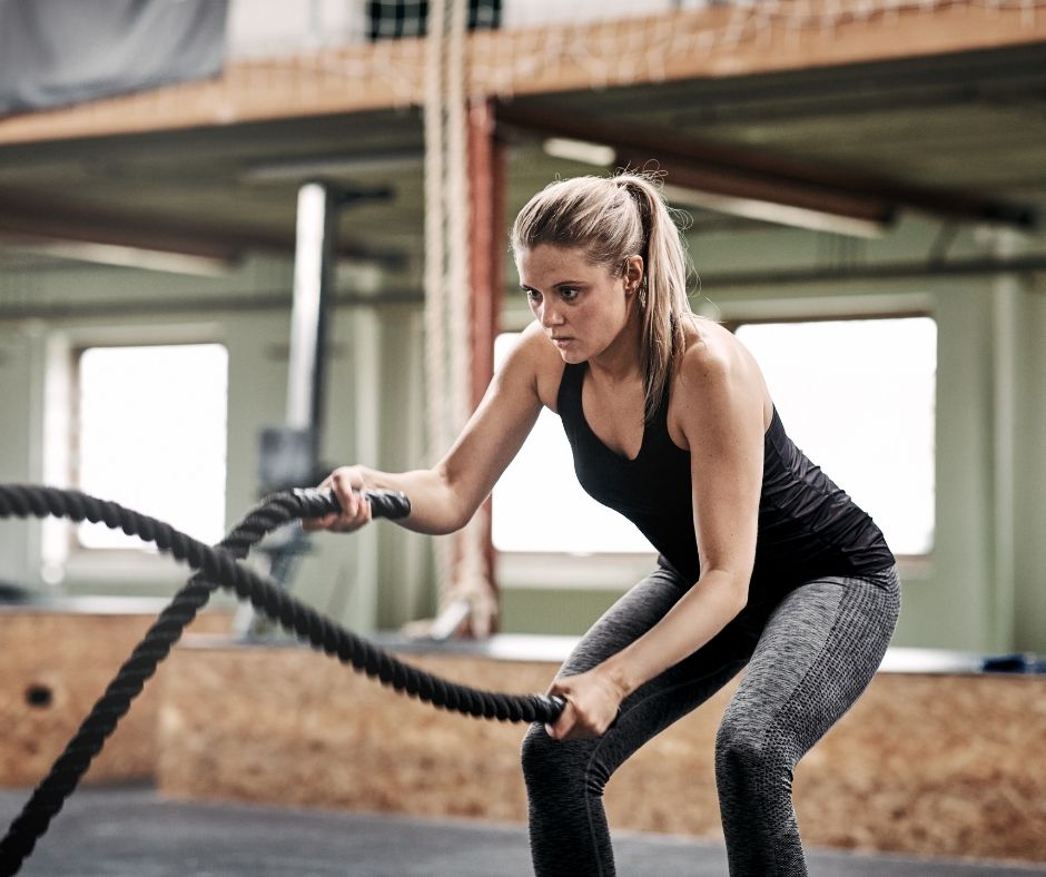 Woman exercising with ropes