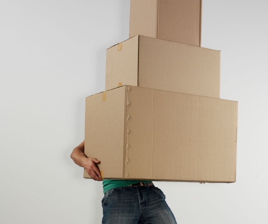 someone carrying boxes, blocking their view