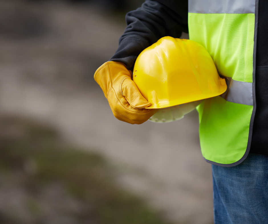 Worker holding a construction hat