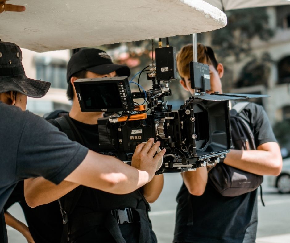 film crew holding a camera