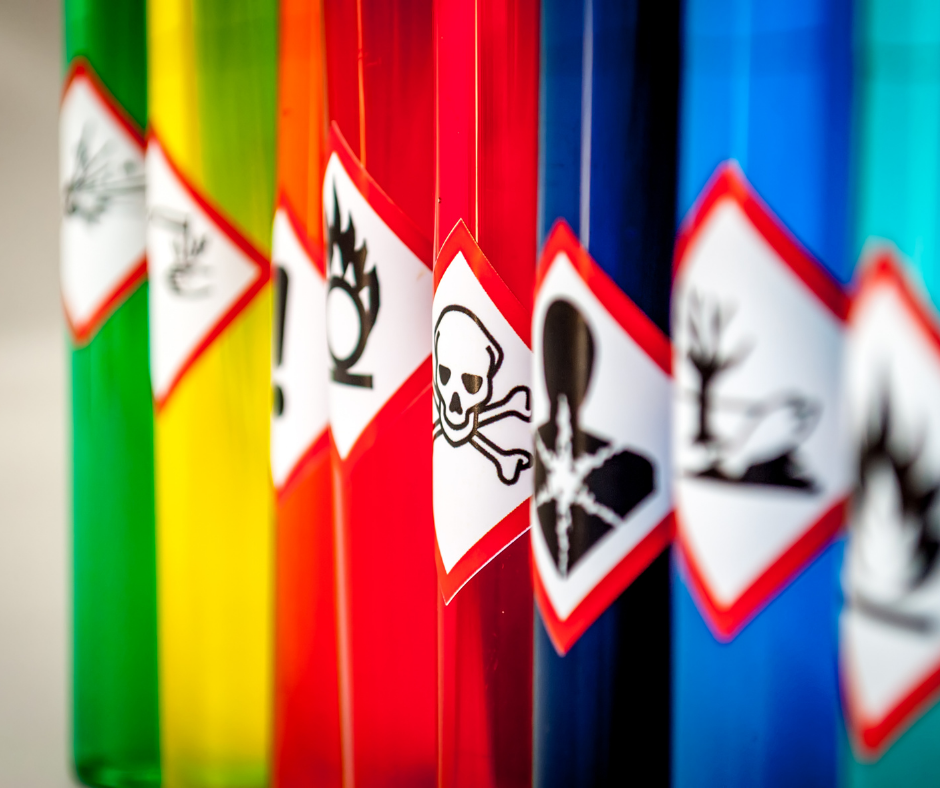 Different coloured tubes with hazardous substance symbols