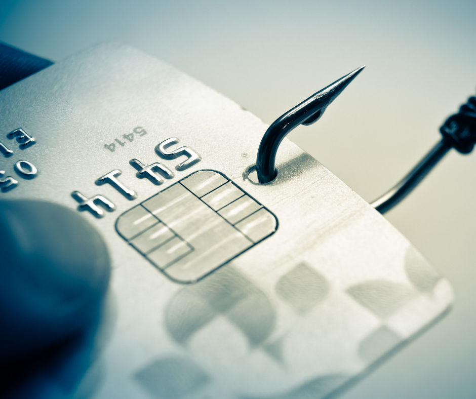 Credit card with a fishing hook through it