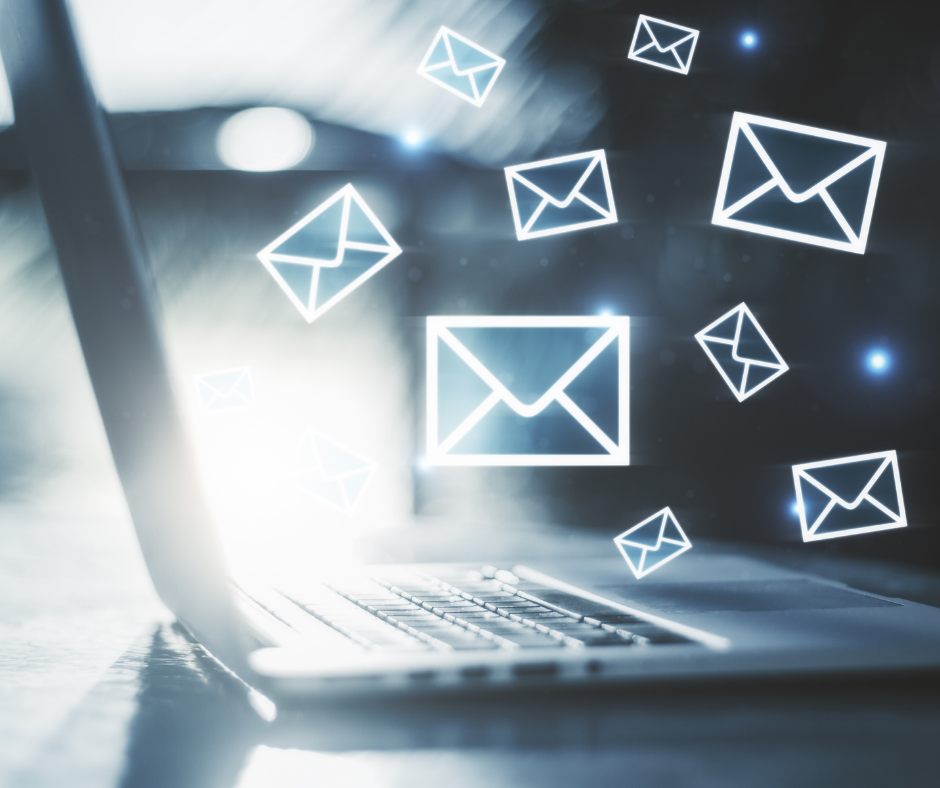 Laptop surrounded by email symbols