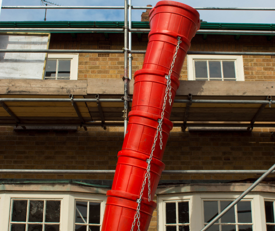 red metal waste chute