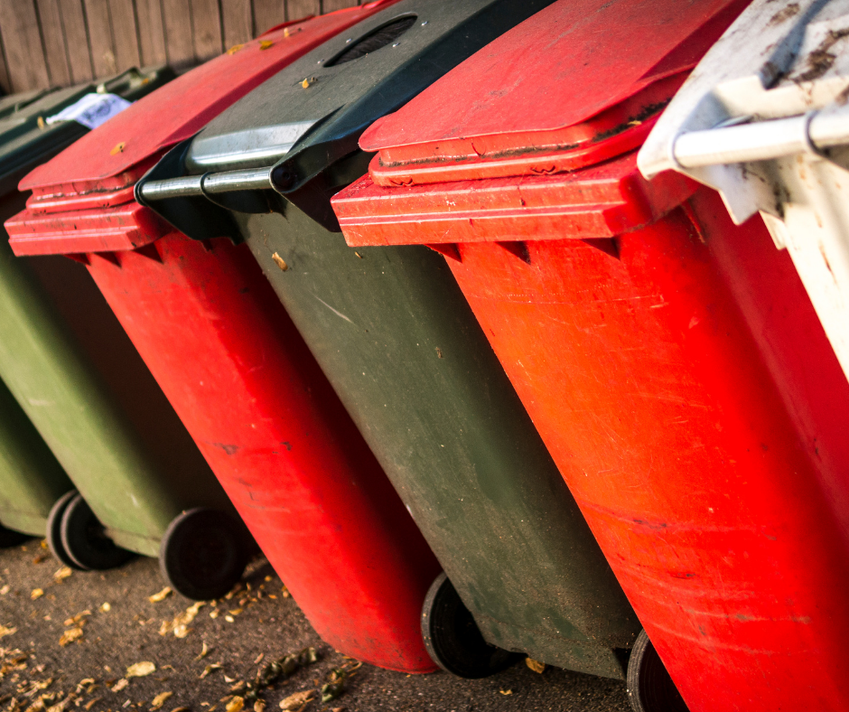 Row of different coloured waste bins
