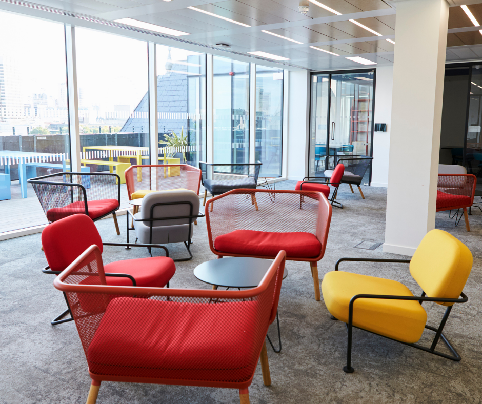 An office break room with sofas and tables
