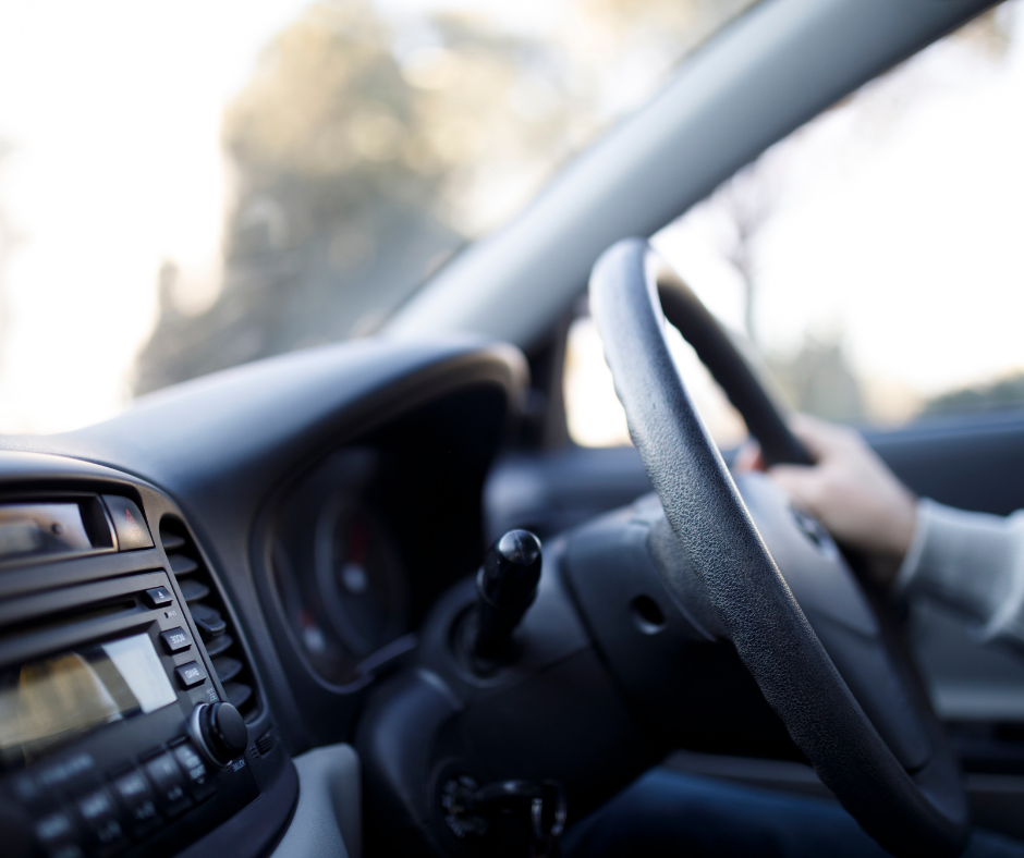 Hand on steering wheel