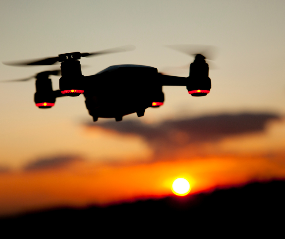 Drone flying at sunset