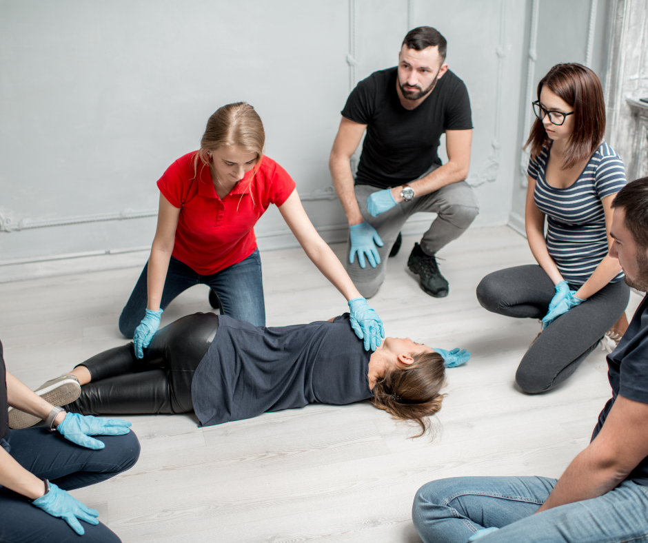first aid training showing class how to do the recovery position