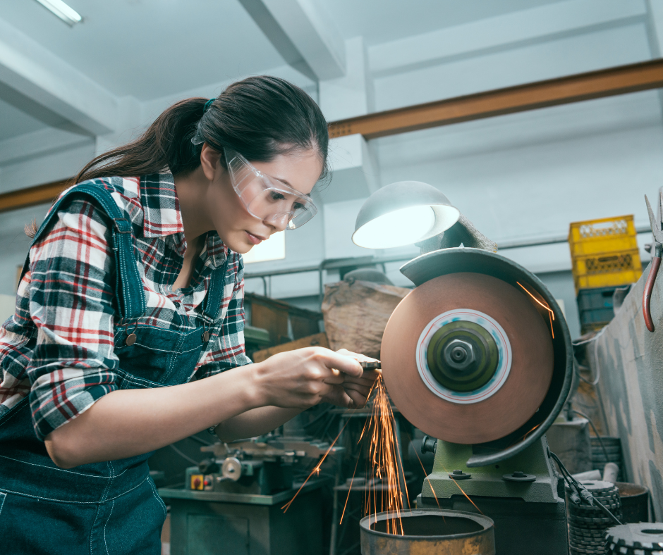 Woman using an abrasive wheel