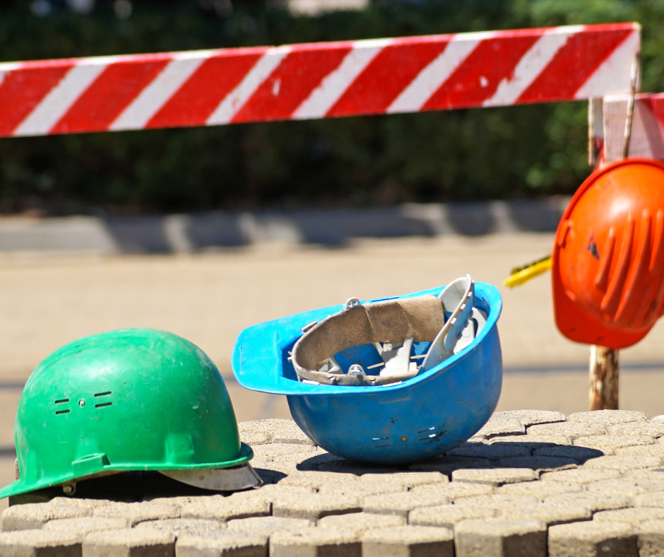 Green, blue and orange safety helmets