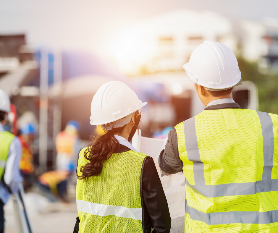 Two construction workers on site