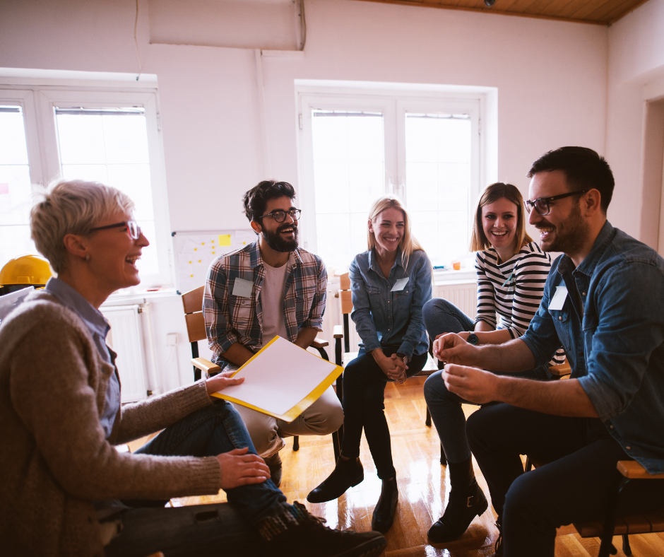 group of people sitting together laughing