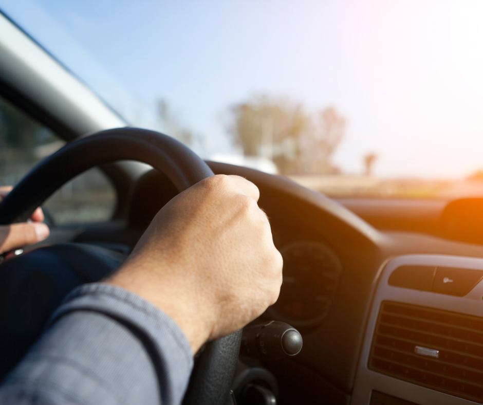 Driver with hands on wheel
