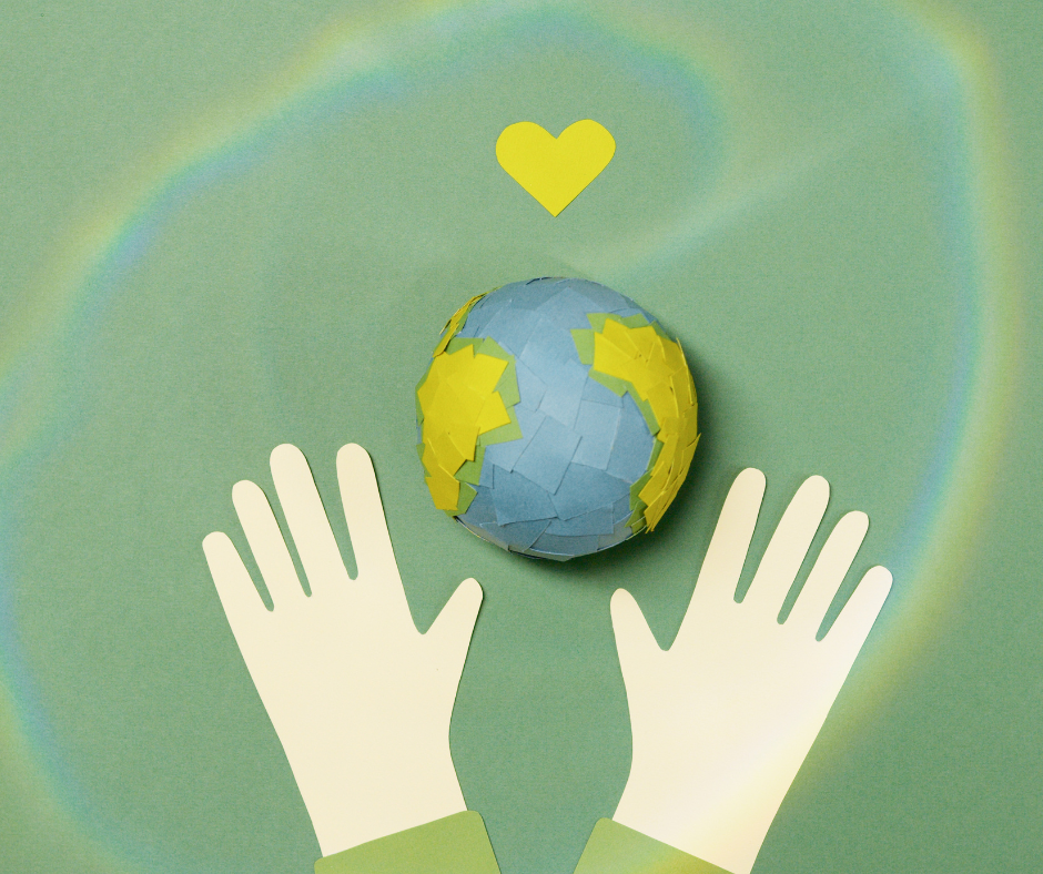 hands holding up a globe made of post-it notes