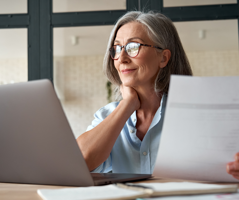 older woman working on a laptop